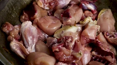 Frying Raw chicken in a pan Stock Footage 135407970