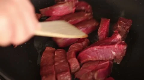 Frying raw meat, close up Stock Footage 57311509