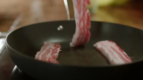 Frying Raw Pork Belly 4K Video stock 193316025