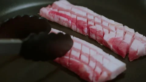 Frying Raw Pork Belly Close Up 4K Video stock 193316390