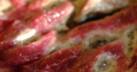 Frying red meat in a skillet Stock Footage 165651973