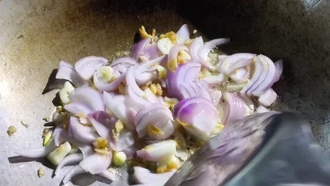 Frying red onion in pan, in door Chiangmai Thailand. Stock Footage 295907284