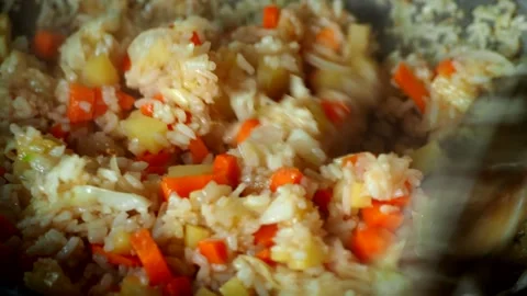 Frying rice with vegetables in pan, in door  Chiangmai Thailand. Stock Footage 282932748