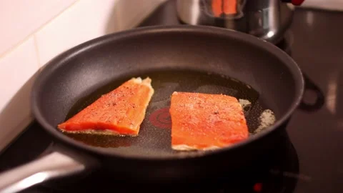 Frying salmon fillet on a pan. Stock-Footage 144357419