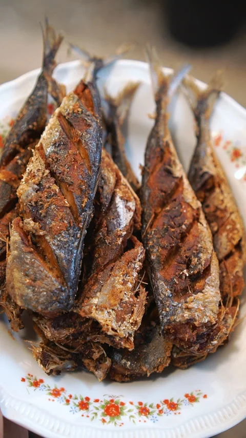 Frying salted fish to serve with Thai sour curry. Stock Footage 336195222