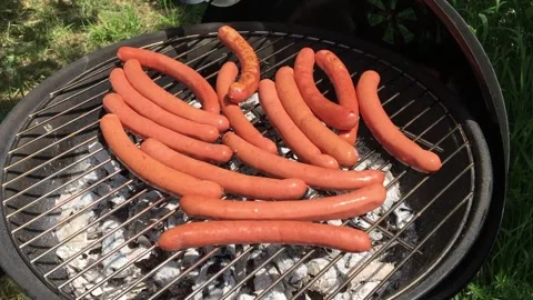 Frying sausages Stock Footage 334562013
