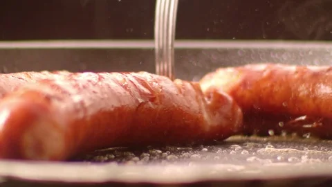 Frying sausages / slow motion shot Stock Footage 74127867