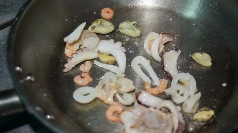 Frying seafood on the hot pan Stock Footage 68316912
