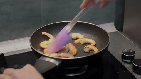 Frying shrimp in a frying pan Stock Footage 232131520