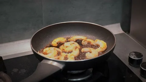 Frying shrimp in a frying pan Stock Footage 232131729