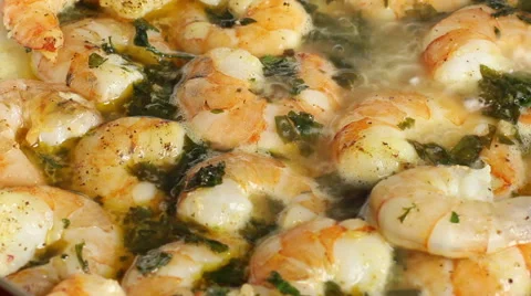 Frying shrimps, salting. Stock Footage 55709780