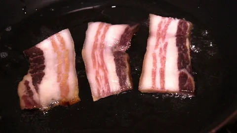 Frying A Slice Of Bacon Close Up Stock Footage 88278964