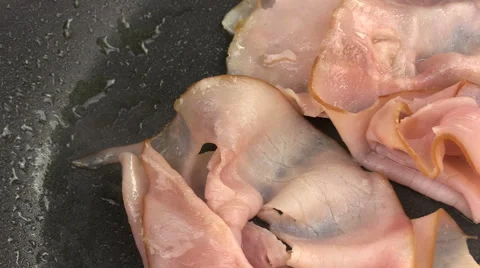 Frying Sliced Ham In Pan Stock Footage 62022429