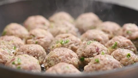 Frying small meatballs in frying pan. Stock Footage 154937407