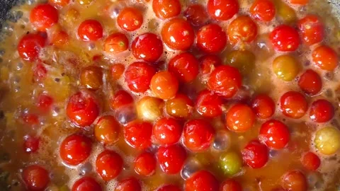 Frying small tomatoes in pan, in door Chiangmai Thailand. Stock Footage 304183508