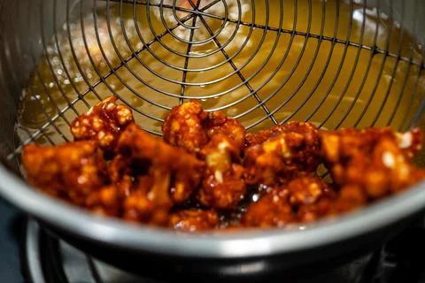 Frying Spicy Cauliflower Stock Photos