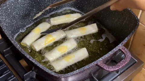 Frying Spring Rolls Stock Footage 313867430