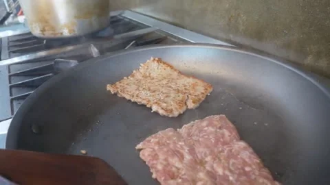 Frying square raw minced meat pizza sausage patties in a pan Video stock 337676608
