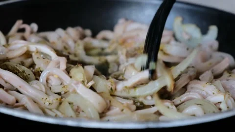 Frying squid rings with spices and onion in frying pan Stock Footage 157752868