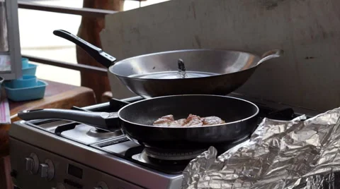 Frying steak in a frying pan Stock Footage 55371629