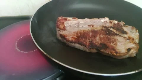 Frying a steak on the hot plate 動画素材 241691757