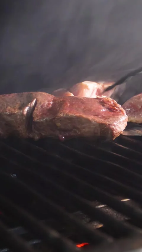 Frying a steak on a josper. Steaks are roasted on a josper oven. Stock Footage 325165413