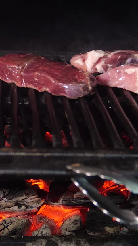 Frying a steak on a josper. Steaks are roasted on a josper oven. Stock Footage 325165415