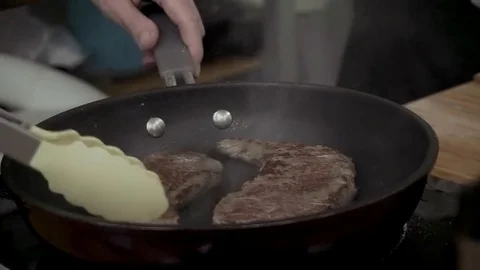 Frying steaks Stock Footage 79507346