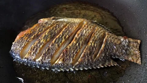 Frying sun-dried fish Stock Footage 315141351