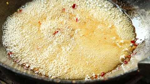 Frying sweet fish sauce in pan , Thai famous food Stock Footage 128135247