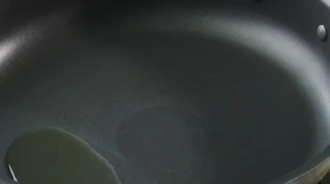 Frying T-bone steak in a frying pan Stock Footage 8572787