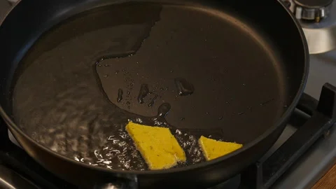 Frying tacos in a frying pan.  Stock Footage 217439787