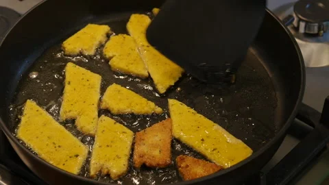 Frying tacos in a frying pan.  스톡 동영상 217446110