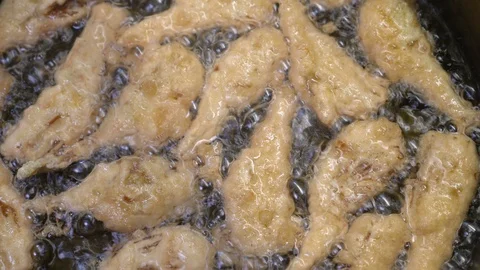 Frying tasty cod breaded with batter -  Typical Italian specialty Stock-Footage 91064125