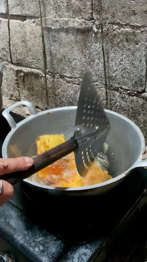 Frying Tempeh in Hot Oil Vertical Footage Stock Footage 325014242