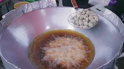 Frying Thai Beef Balls in Wok, Cooking Meatballs in Hot Oil Thailand Street Food Stock Footage 228883890