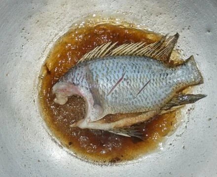 Frying tilapia Stock Photos