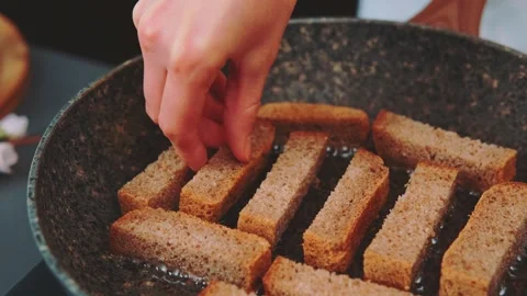 Frying toasted bread in a frying pan Stock Footage 249390660