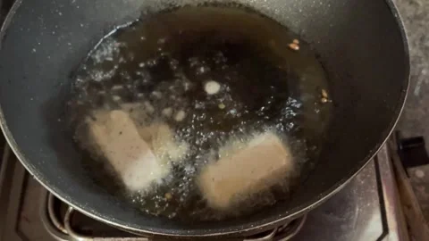 Frying Tofu First time on frying pan 스톡 동영상 287583965