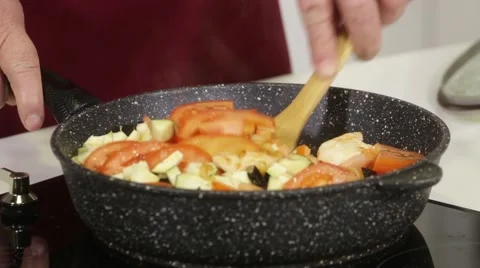 Frying tomato and squash and onion Stock Footage 49783614