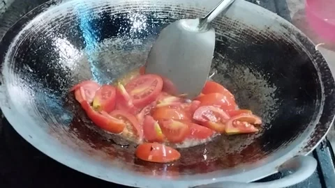 Frying tomatoes the traditional way Stock Footage 219215015