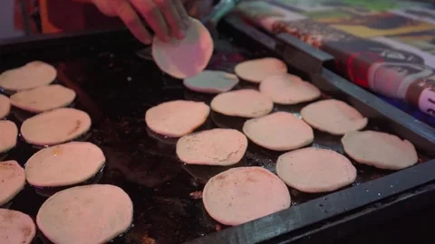 Frying tortillas on a griddle Stock Footage 295450617