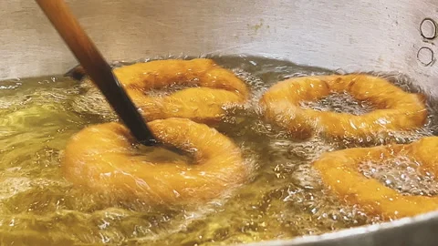 Frying Traditional Peruvian Picarones in Hot Oil Stock Footage 341440834
