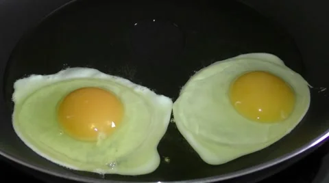 Frying two eggs Stock Footage 46688411