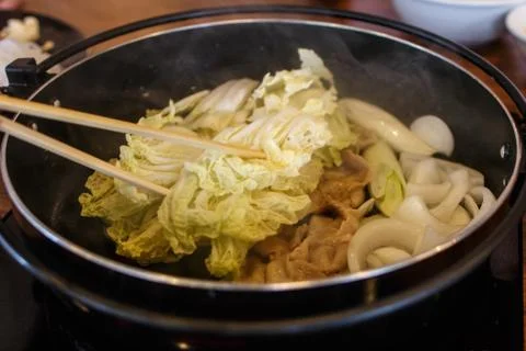 Frying vegetable in a hot pan Stock Photos