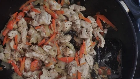Frying vegetables and chicken overhead Stock Footage 98361080