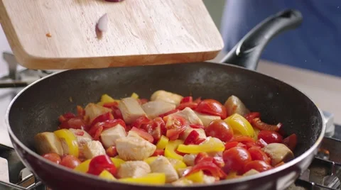 Frying vegetables and chicken white meat. Stock Footage 46449522
