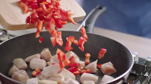 Frying vegetables and chicken white meat. Stock Footage 46450229