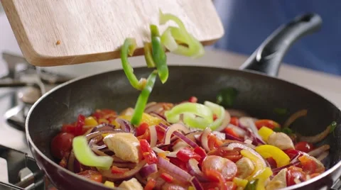 Frying vegetables and chicken white meat. Video stock 46450807