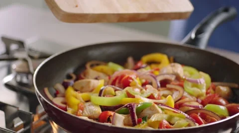 Frying vegetables and chicken white meat. Stock Footage 46451231